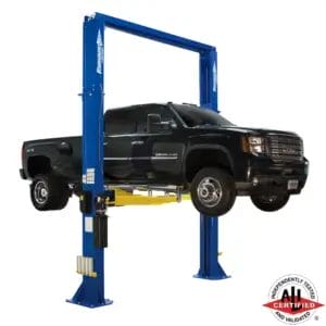 Forward Lift DP18 two-post lift elevating a black GMC Denali HD truck, ALI certified