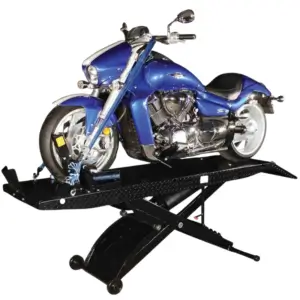 Blue cruiser motorcycle secured on a Direct Lift motorcycle lift with scissor-style hydraulic platform