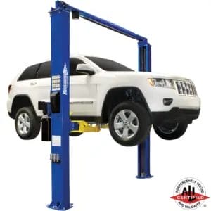 White Jeep Grand Cherokee lifted on a Forward Lift I10 two-post automotive lift, ALI certified
