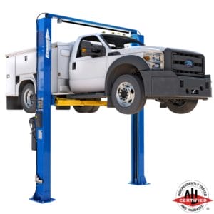 White Ford service utility truck elevated on a Forward Lift I12 two-post lift, ideal for heavy-duty vehicle maintenance, ALI certified