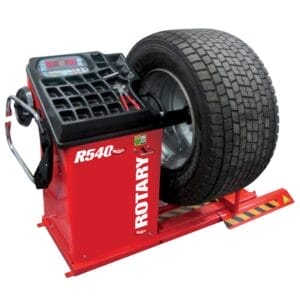 Rotary R540 RTLD Truck 2D Wheel Balancer with a large commercial truck tire mounted, featuring a digital control panel and integrated tool tray.